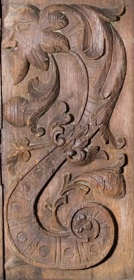 A surviving carved oak panel from Baltersan Castle: a face among acanthus scrolls